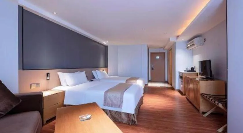 Bed in Zhongshan Louis Hotel