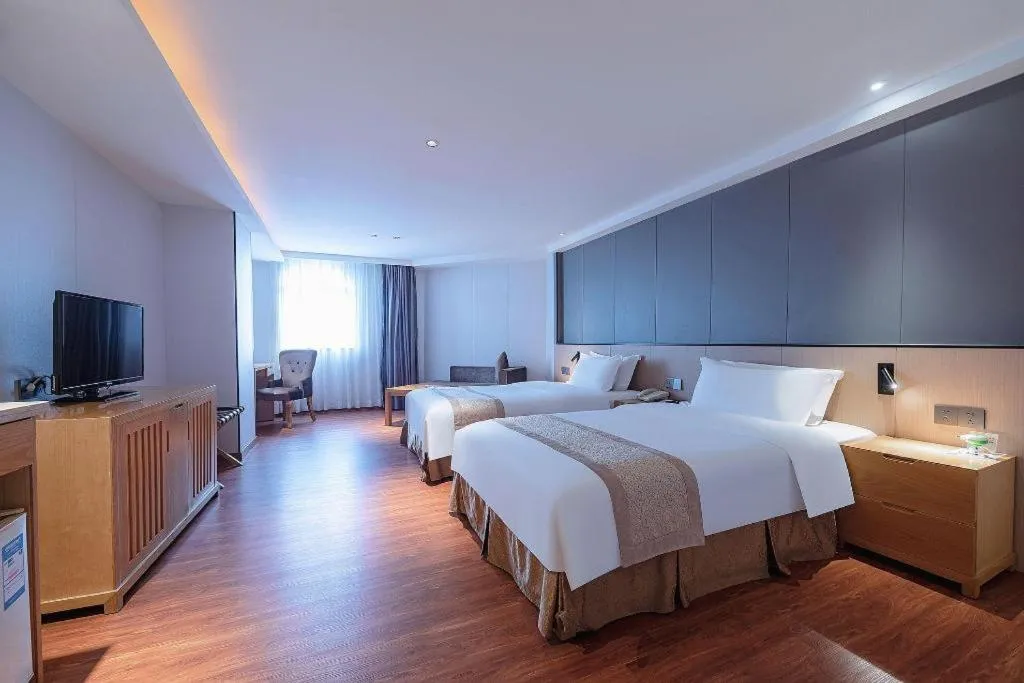 Bed in Zhongshan Louis Hotel