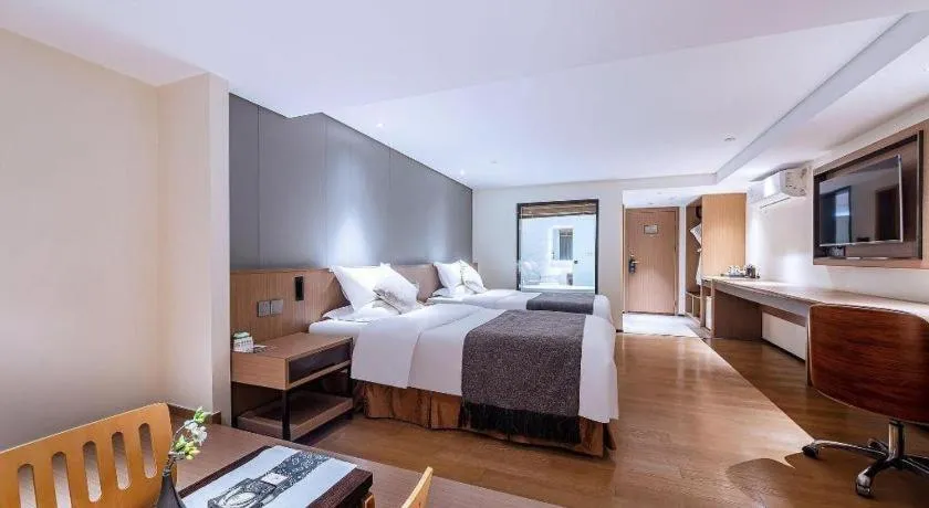 Bed in Zhongshan Louis Hotel