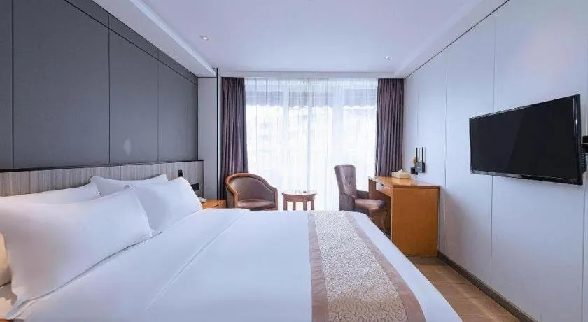 Bed in Zhongshan Louis Hotel