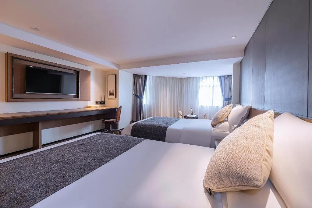 Bed in Zhongshan Louis Hotel