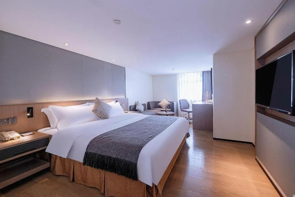 Bed in Zhongshan Louis Hotel