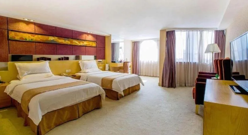 Bed in Zhongshan Louis Hotel