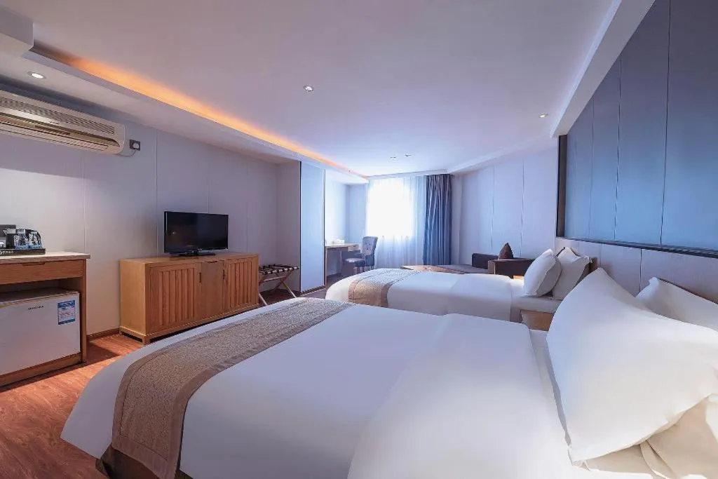 Bed in Zhongshan Louis Hotel