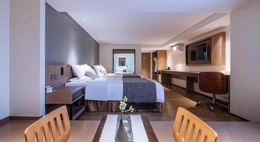 Bed in Zhongshan Louis Hotel