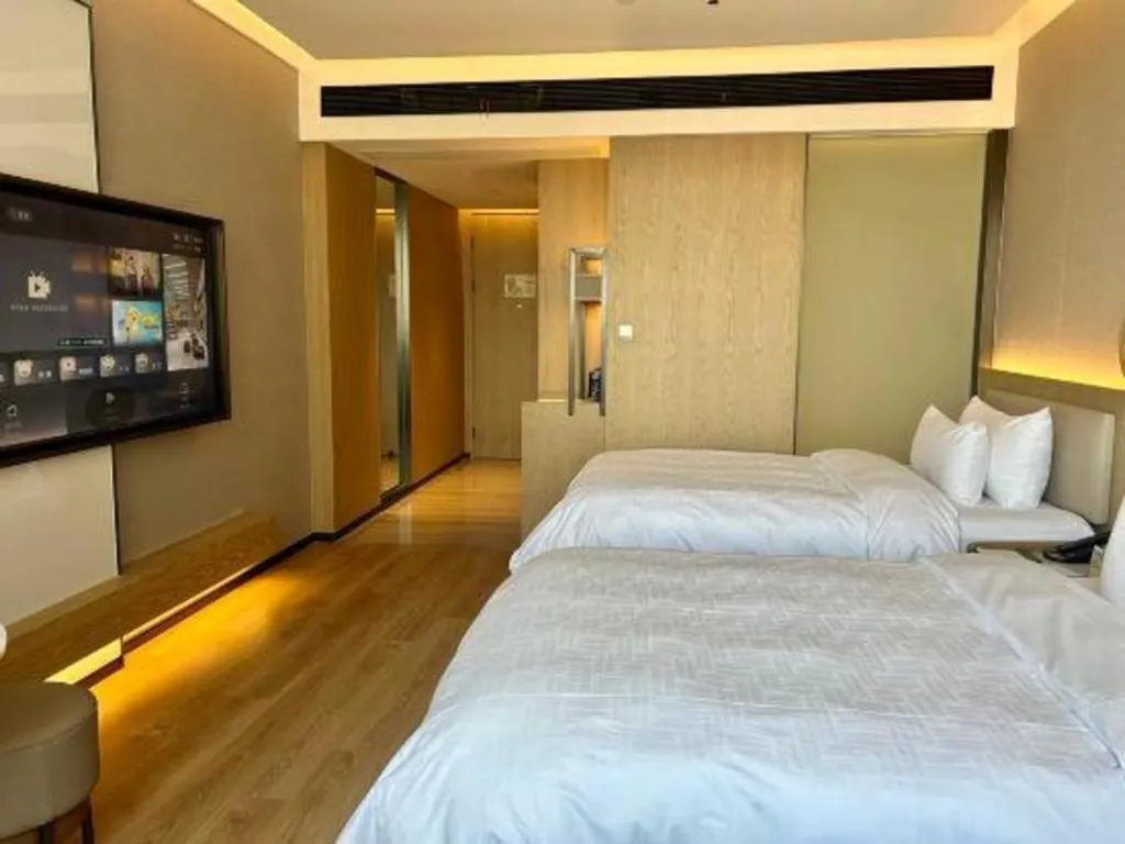 Bed in Zhangjiagang Jiangnan Garden Hotel