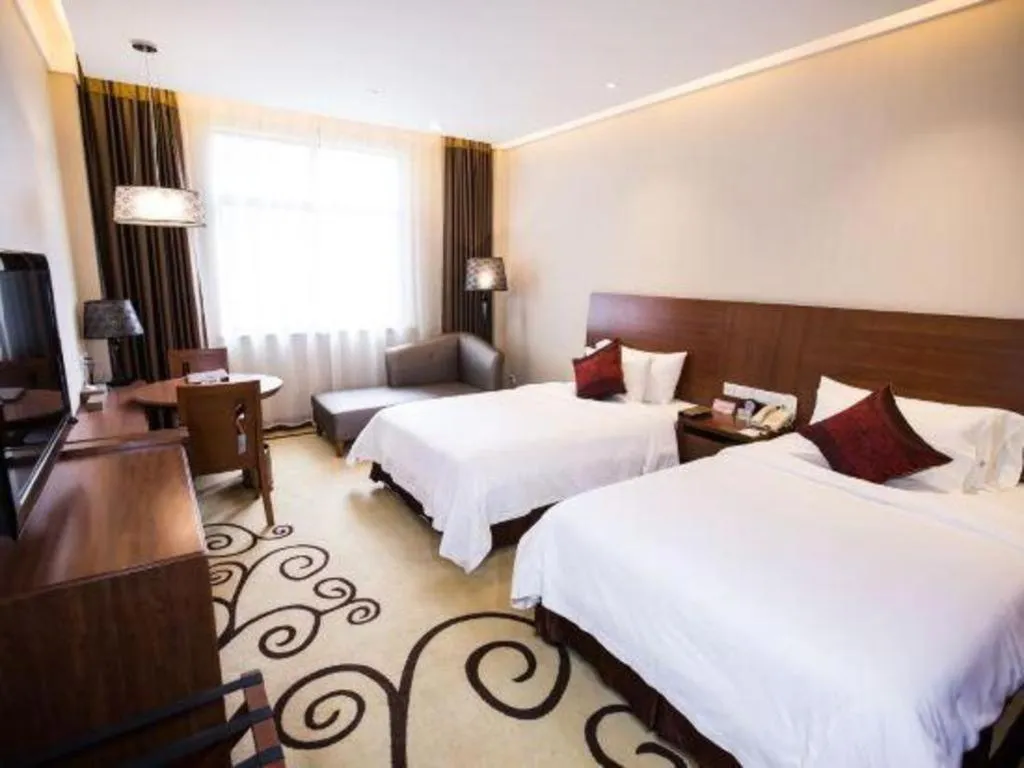 Bed in Zhangjiagang Jiangnan Garden Hotel