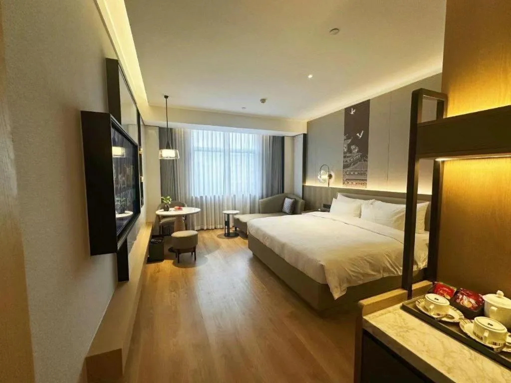 Bed in Zhangjiagang Jiangnan Garden Hotel