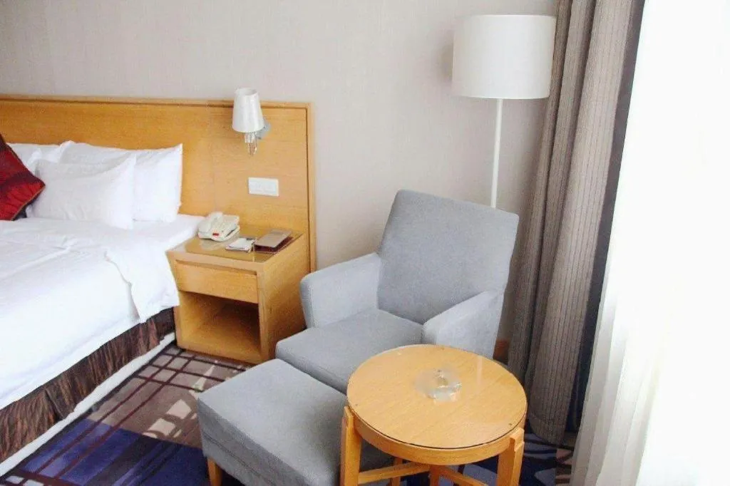 Bed in Zhangjiagang Jiangnan Garden Hotel