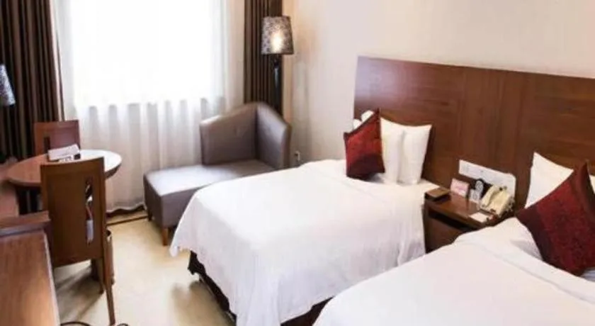 Bed in Zhangjiagang Jiangnan Garden Hotel