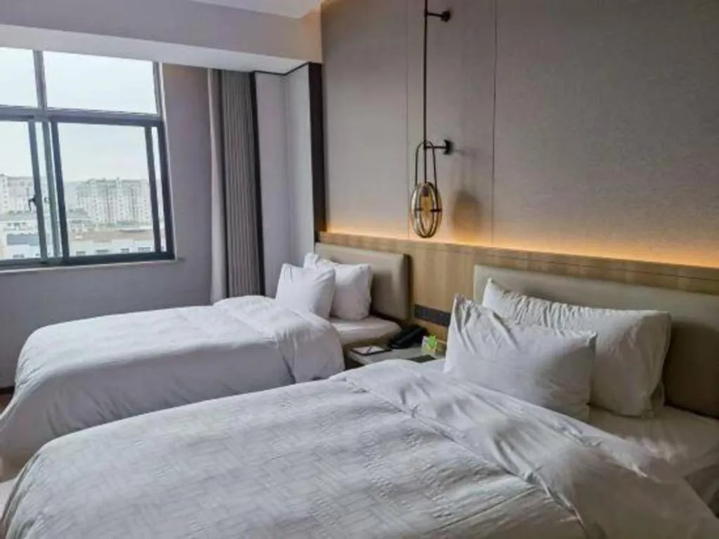 Bed in Zhangjiagang Jiangnan Garden Hotel