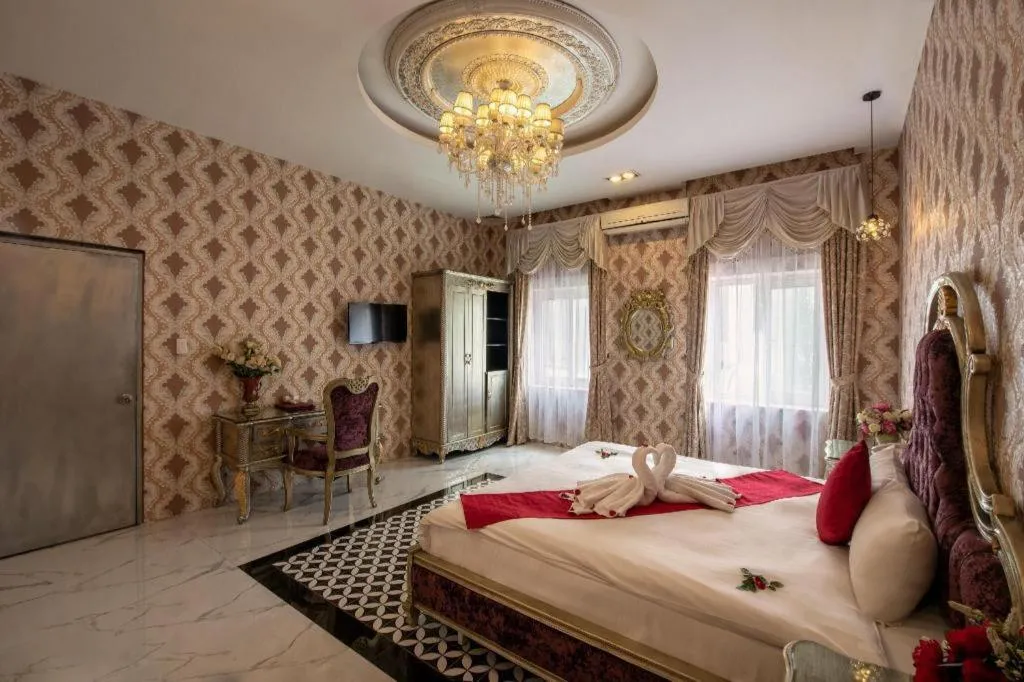 Bed in Helios Legend Hotel