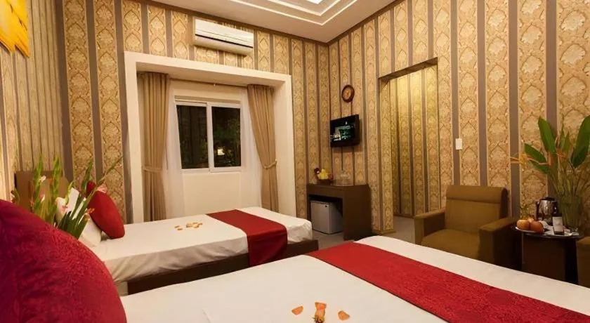 Bed in Helios Legend Hotel