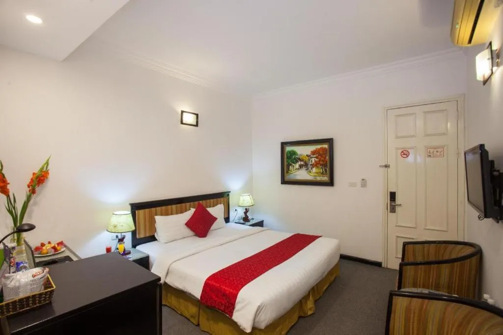 Bed in Helios Legend Hotel