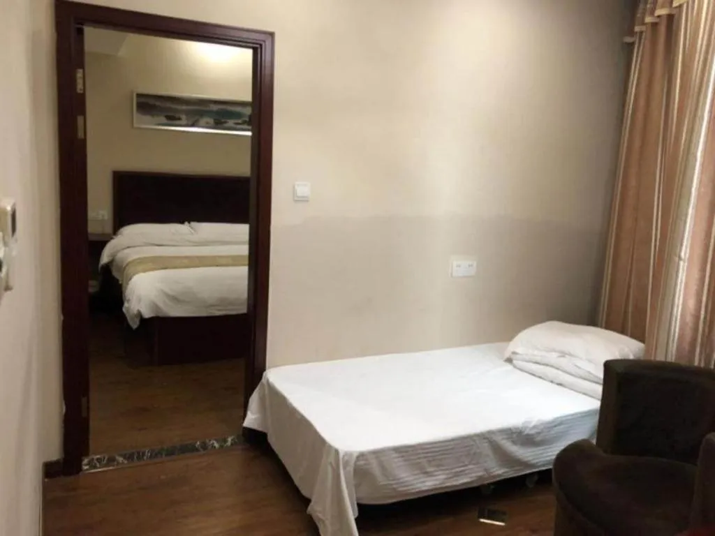 Bed in GreenTree Inn Jiangsu Wuxi New District High Speed Rail Station Newland Family Express Hotel