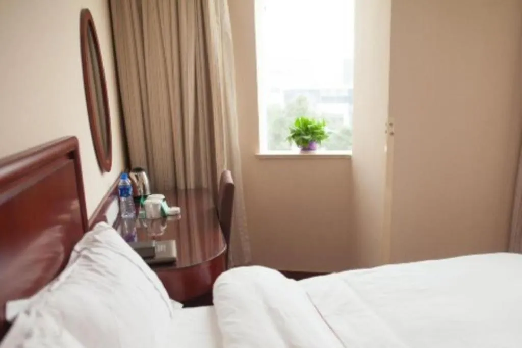 Bed in GreenTree Inn Jiangsu Wuxi New District High Speed Rail Station Newland Family Express Hotel