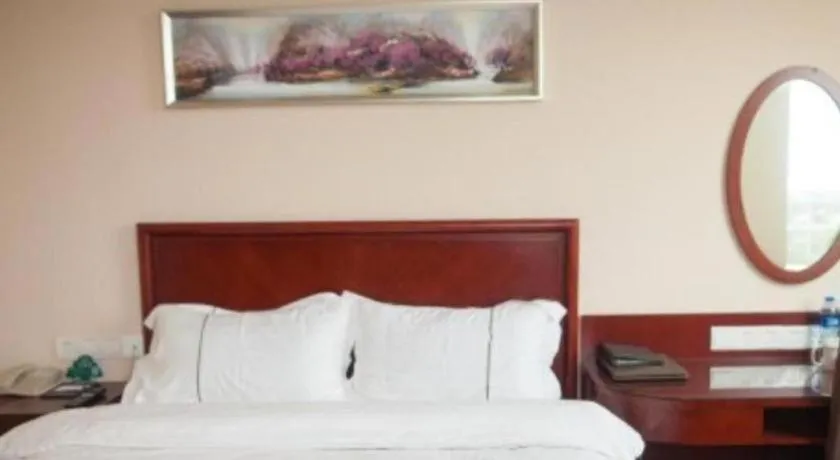 Bed in GreenTree Inn Jiangsu Wuxi New District High Speed Rail Station Newland Family Express Hotel