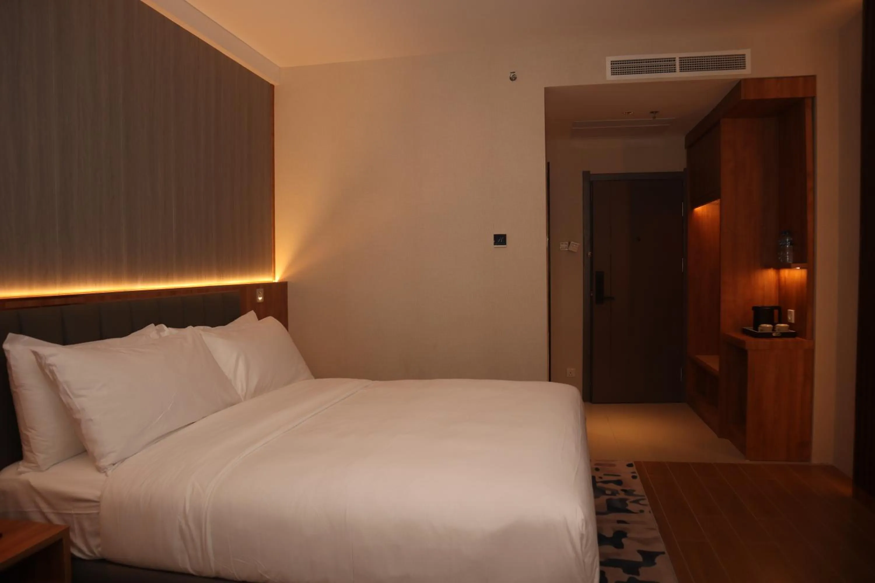 Bed in Aglow Hotel Harbor Bay Batam