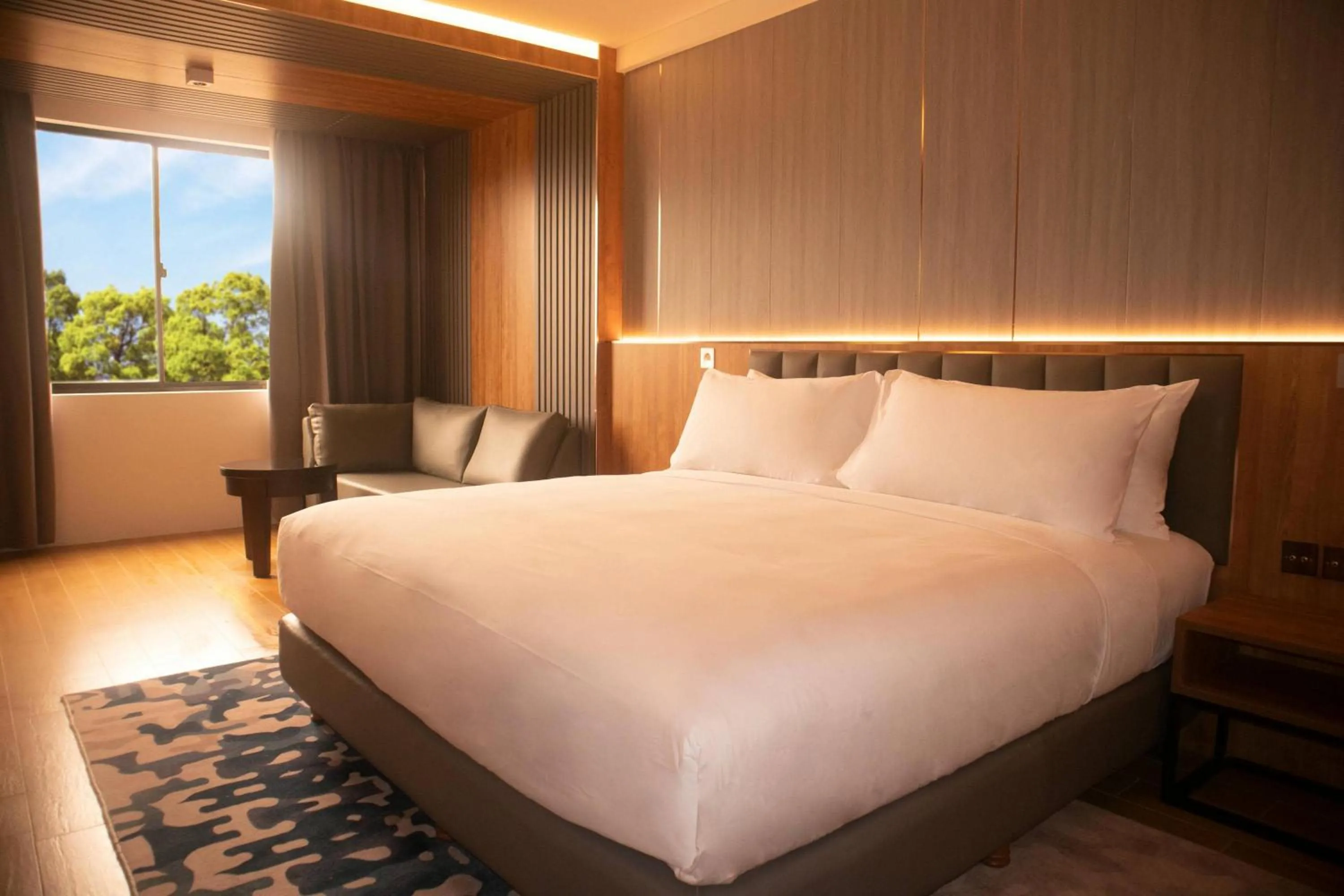 Bed in Aglow Hotel Harbor Bay Batam