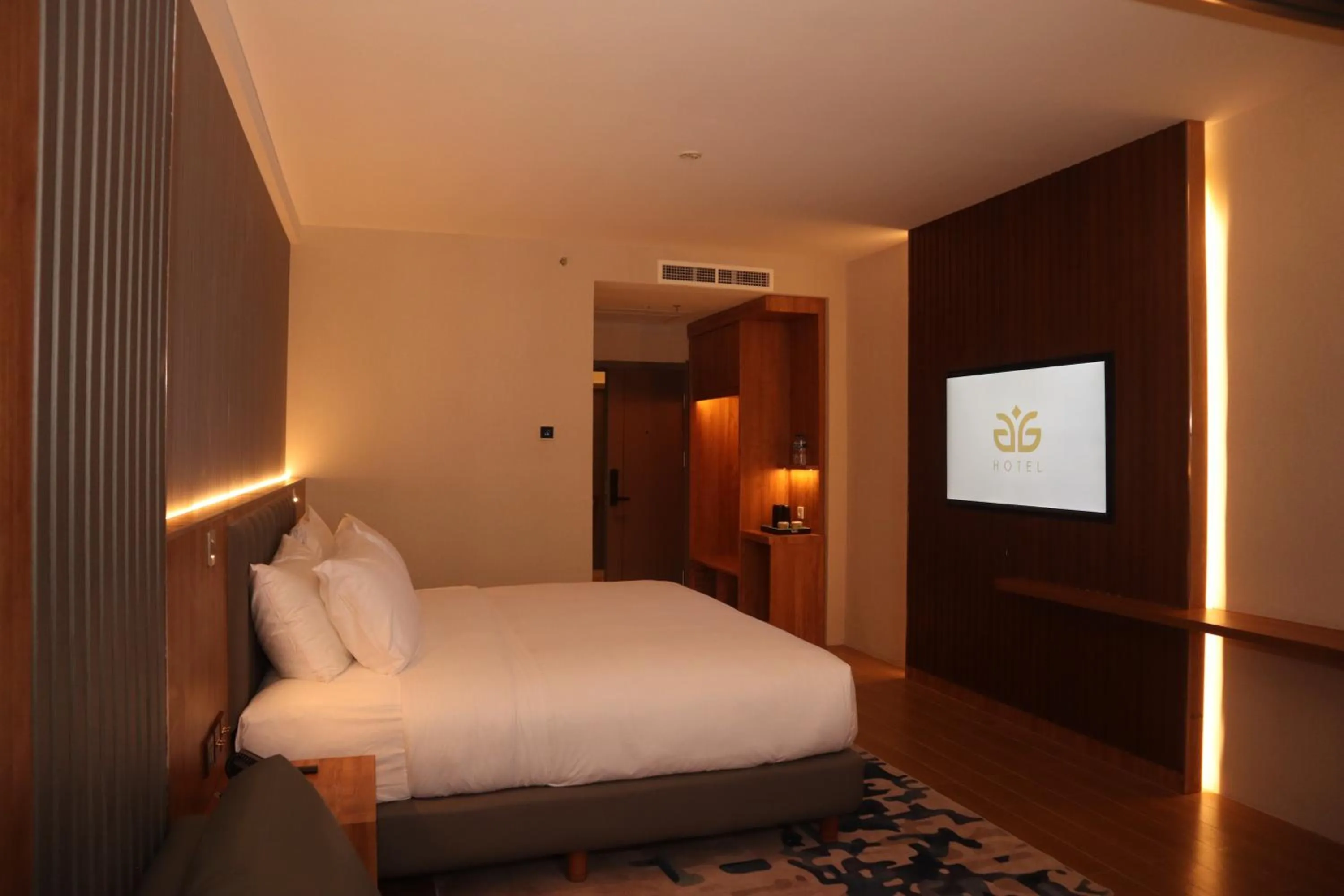 Bed in Aglow Hotel Harbor Bay Batam