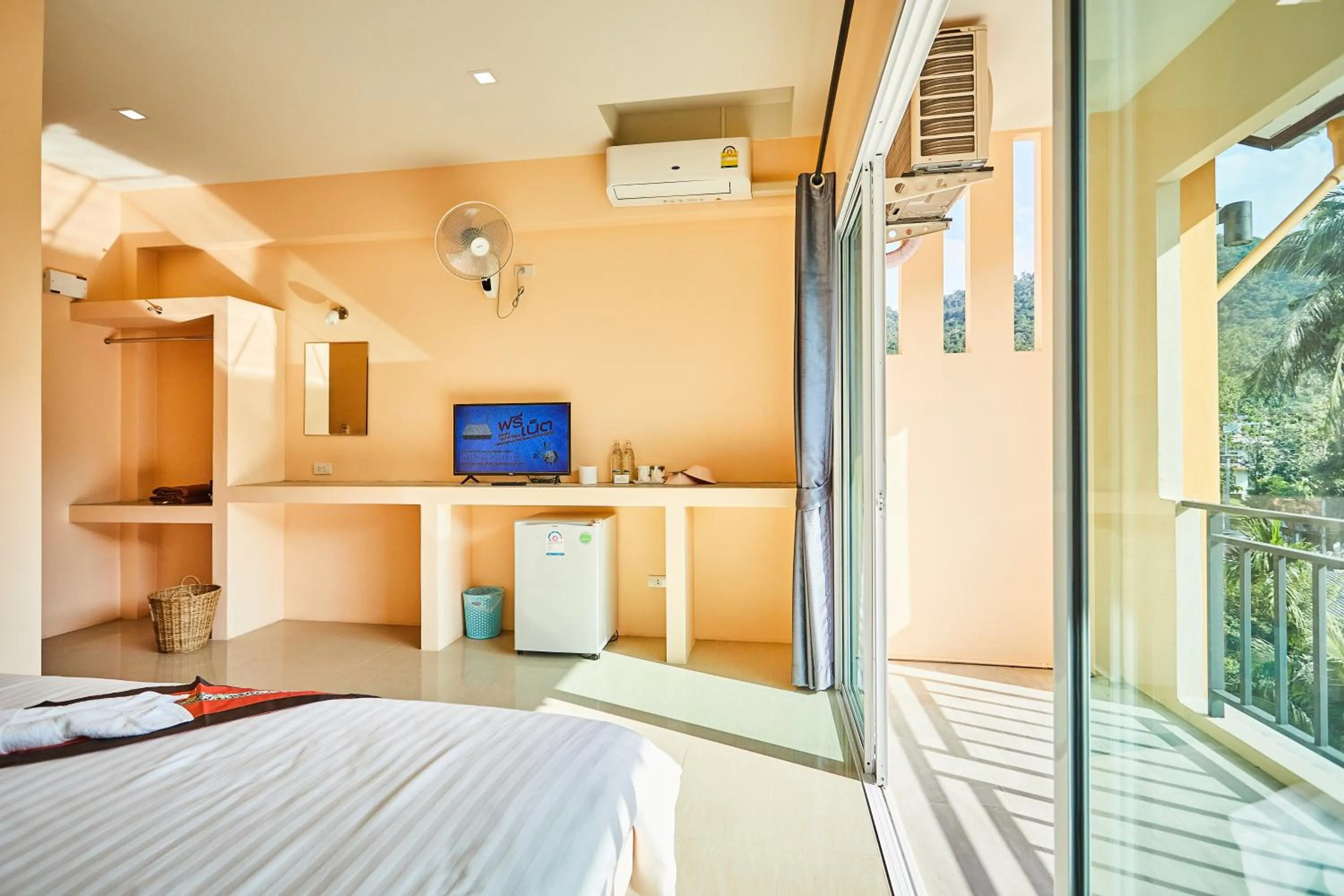 Bed in Coco Palm Hotel Koh tao