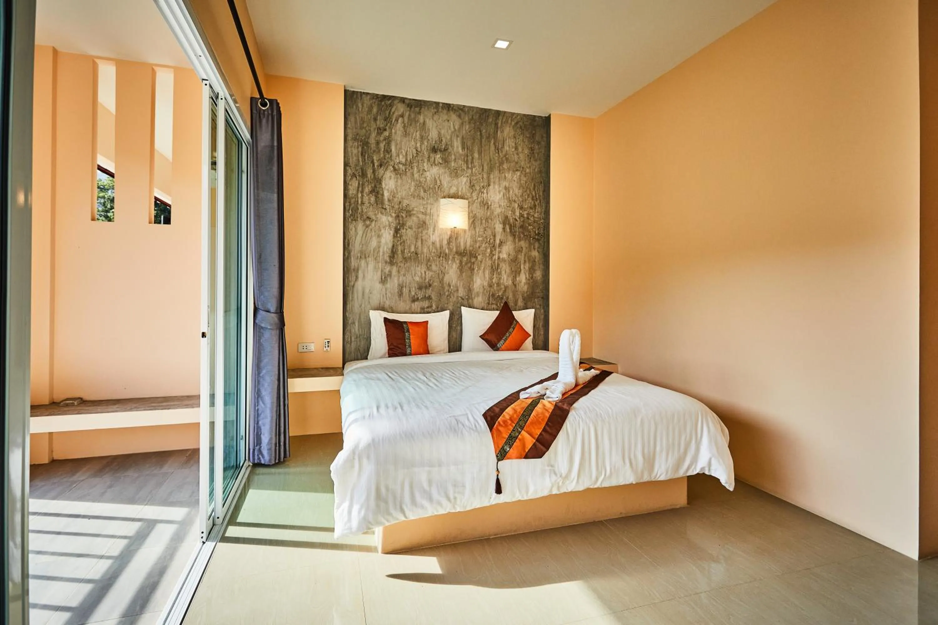 Bed in Coco Palm Hotel Koh tao