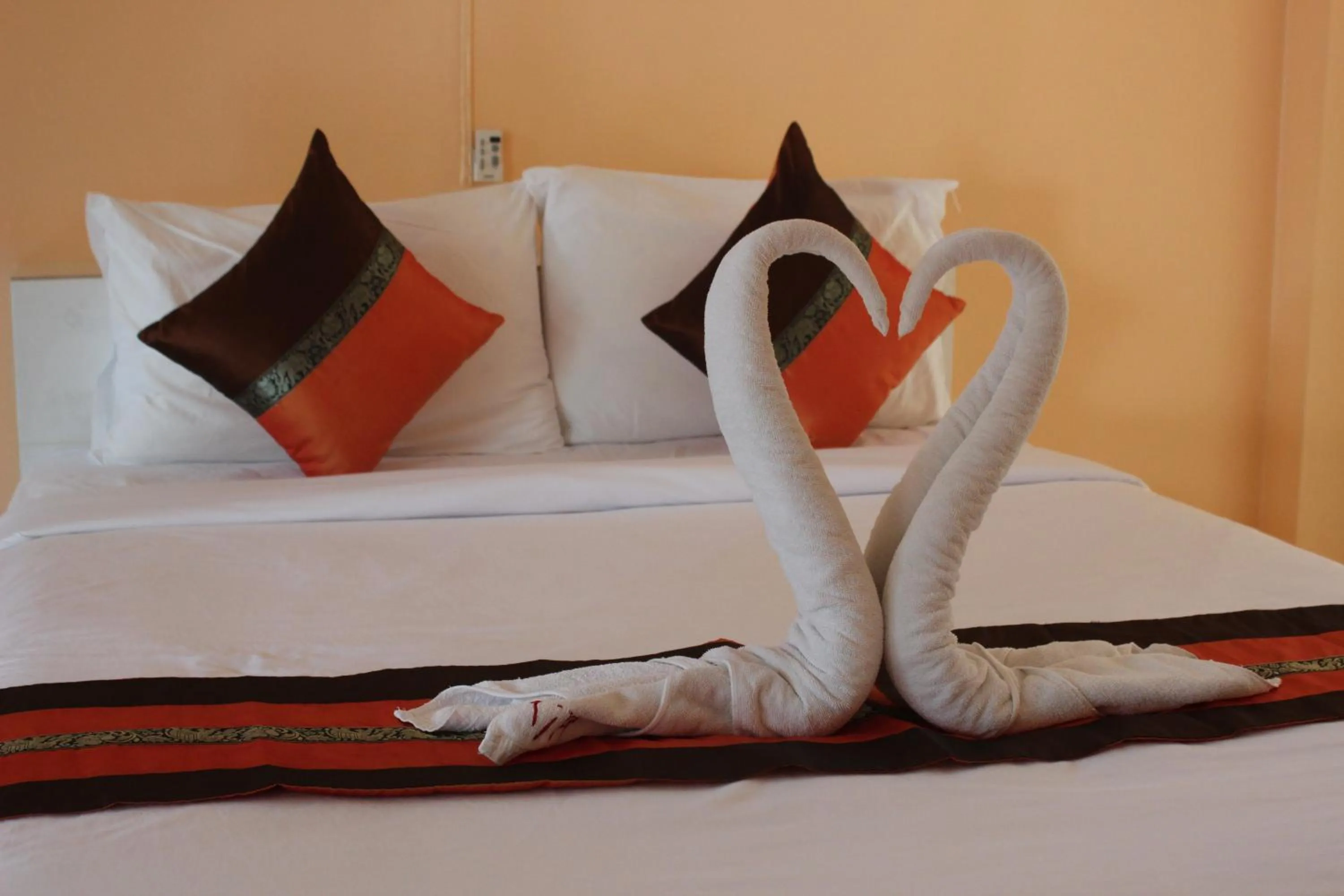 Bed in Coco Palm Hotel Koh tao