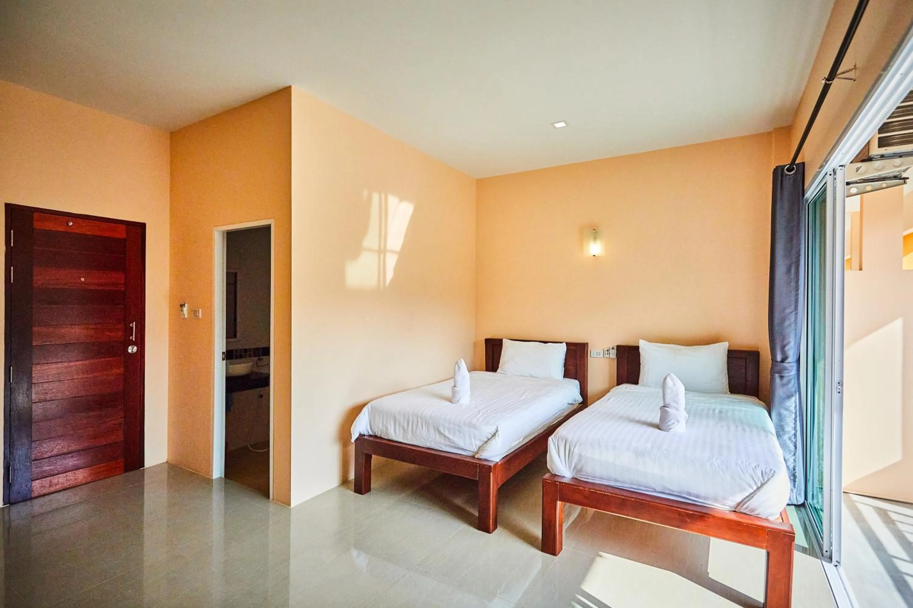 Bed in Coco Palm Hotel Koh tao