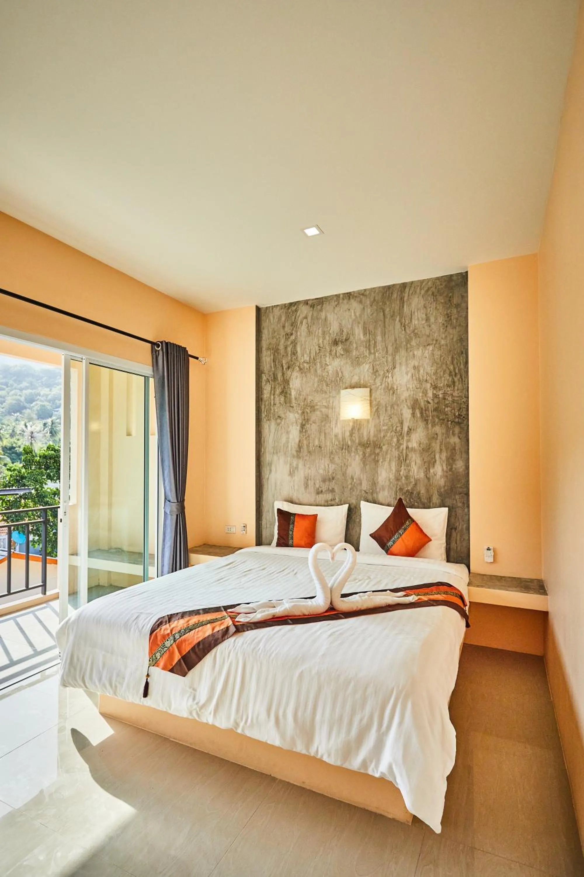 Bed in Coco Palm Hotel Koh tao