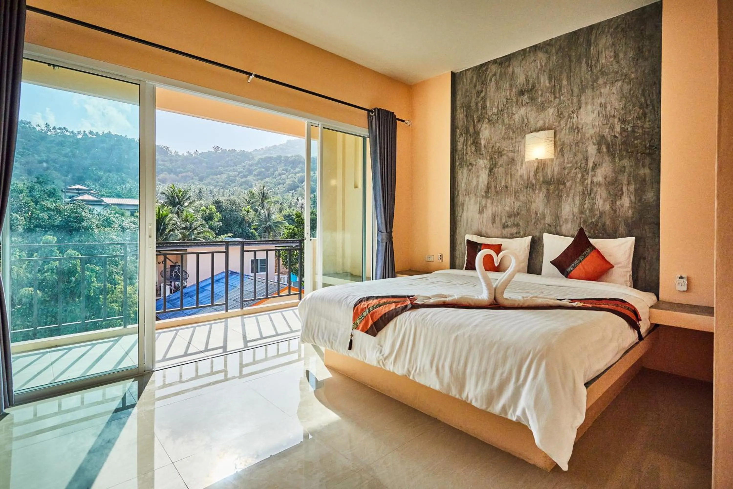 Bed in Coco Palm Hotel Koh tao