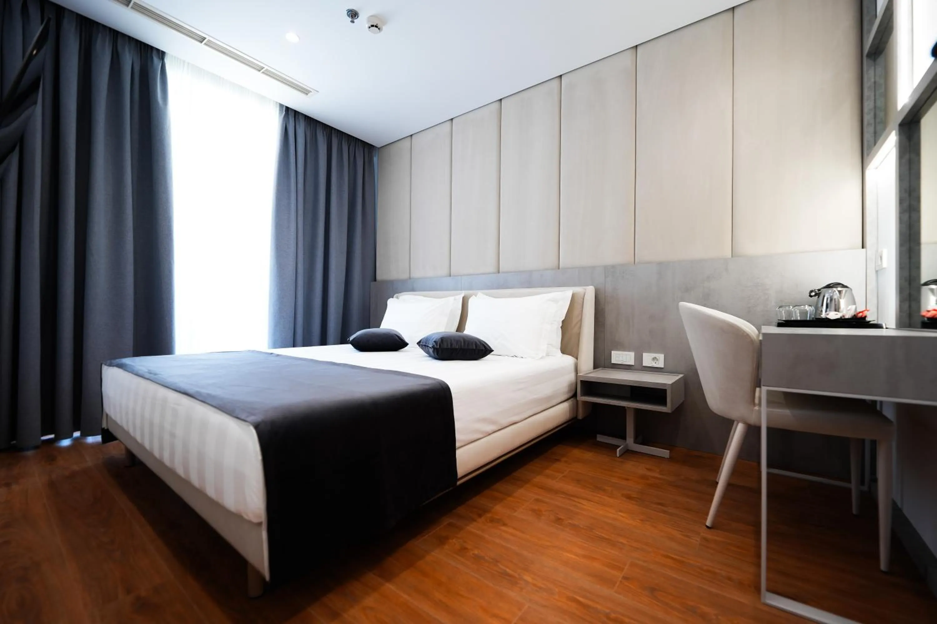 Photo of the whole room, Bed in Naos Luxury Hotel