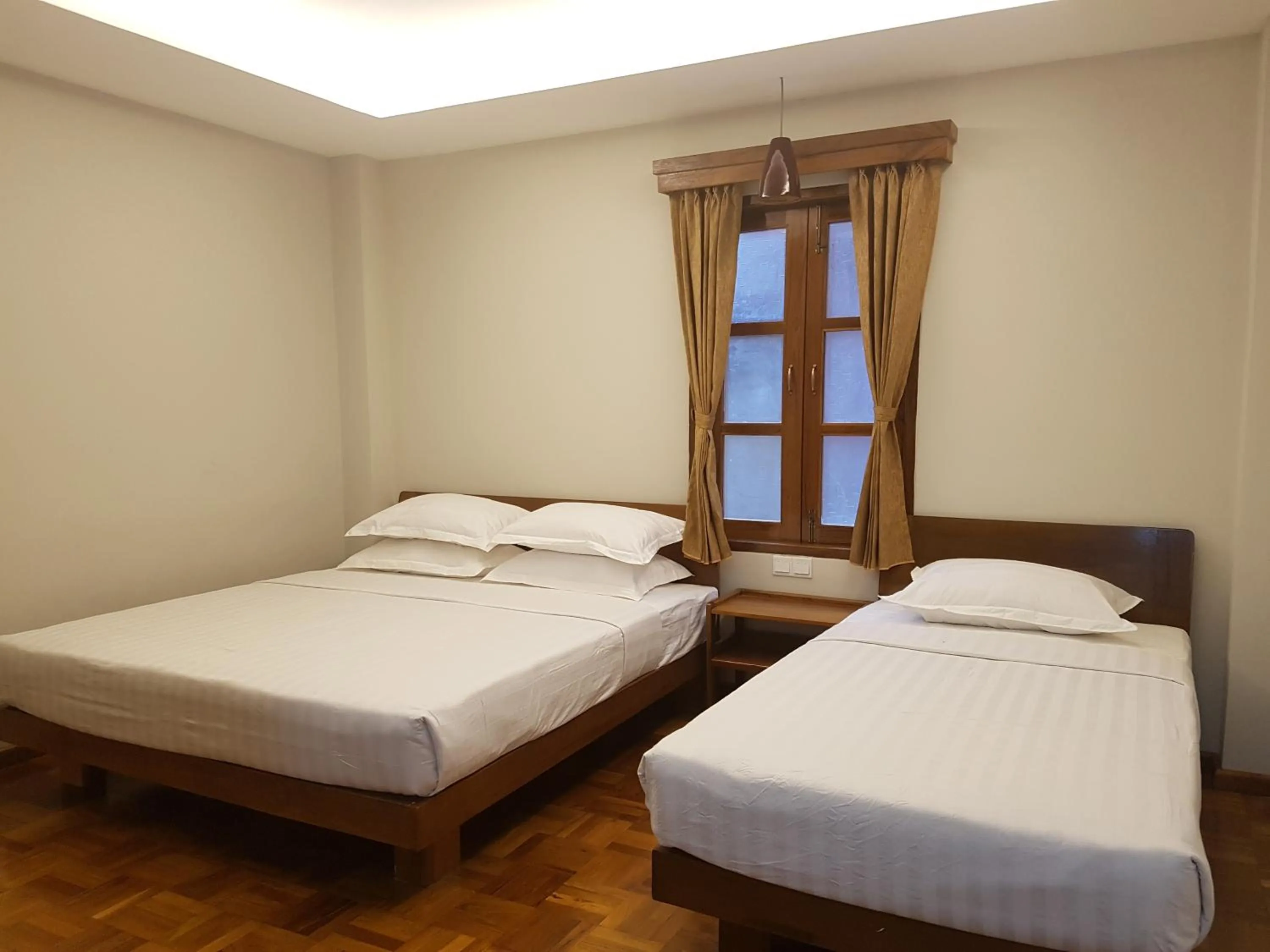 Bed in Northern Breeze Hotel