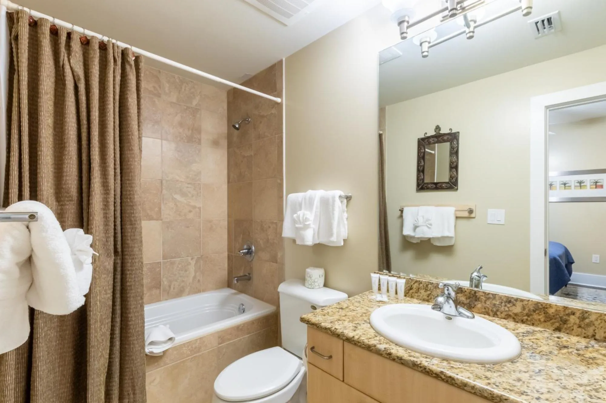 Bathroom in Caribe Resort by Hosteeva