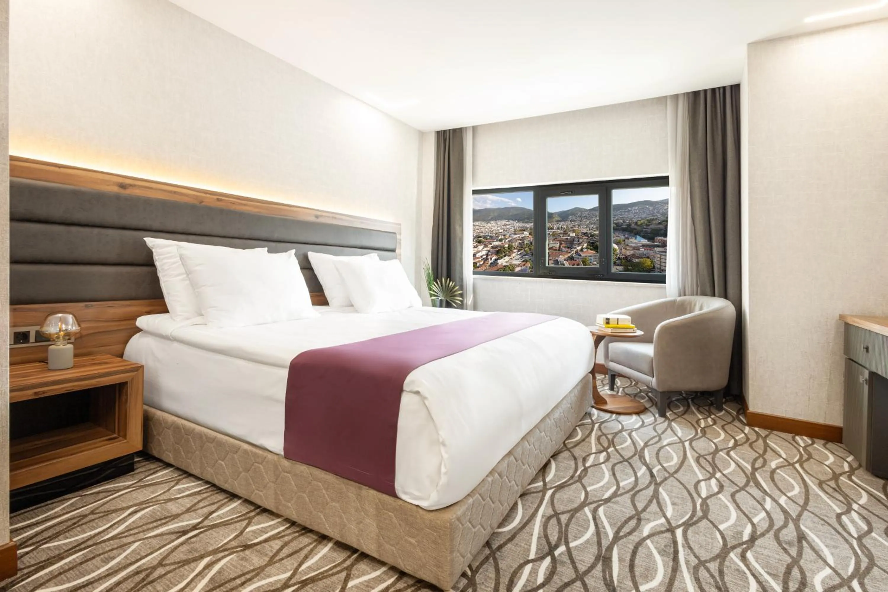 Bed in Lilium Hotel & Suites