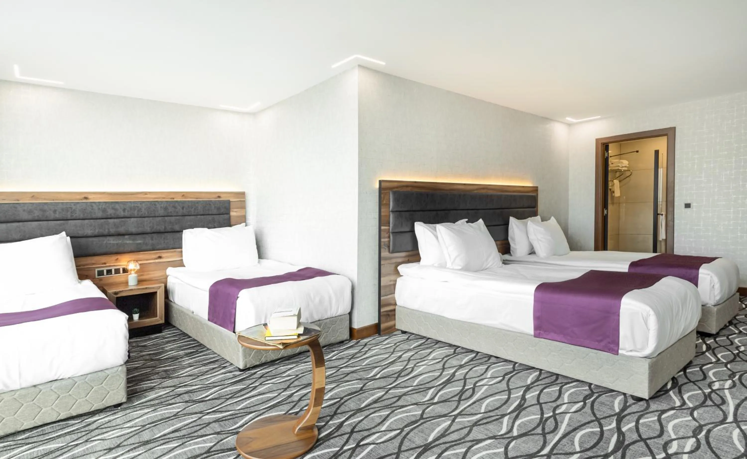 Bed in Lilium Hotel & Suites