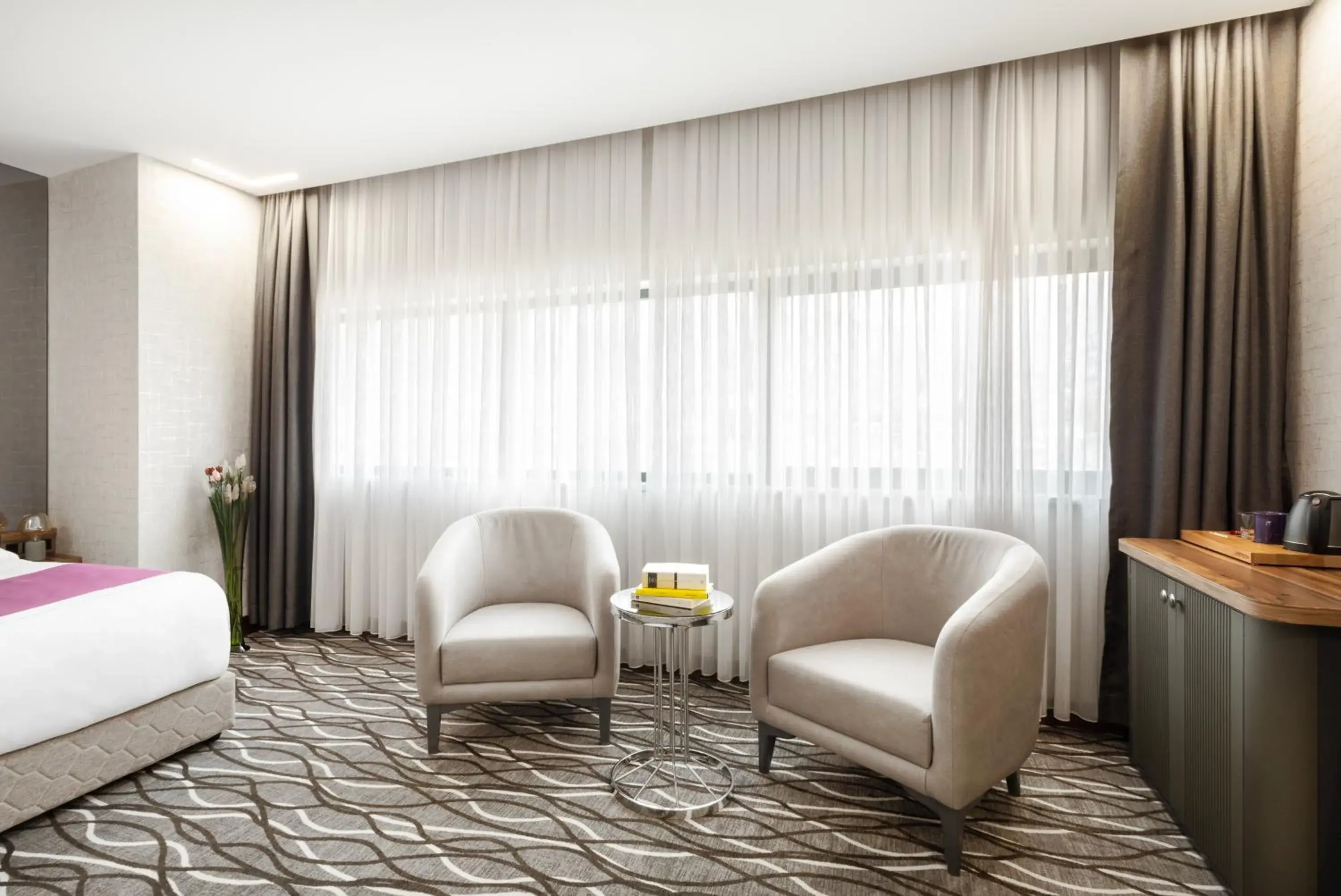 Seating area, Bed in Lilium Hotel & Suites Seating area, Bed in Lilium Hotel & Suites