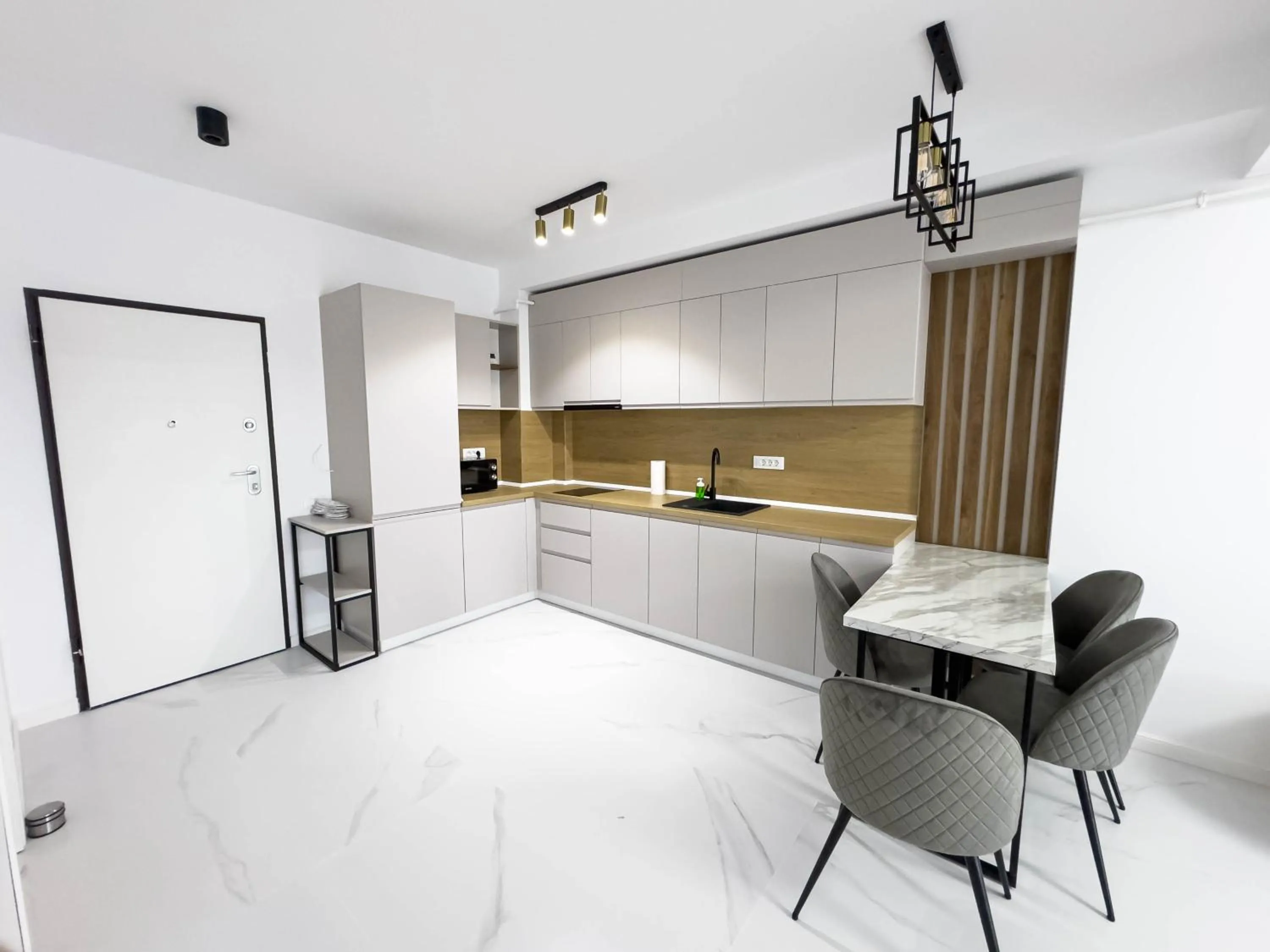 Kitchen or kitchenette in Wave 6 Apartments