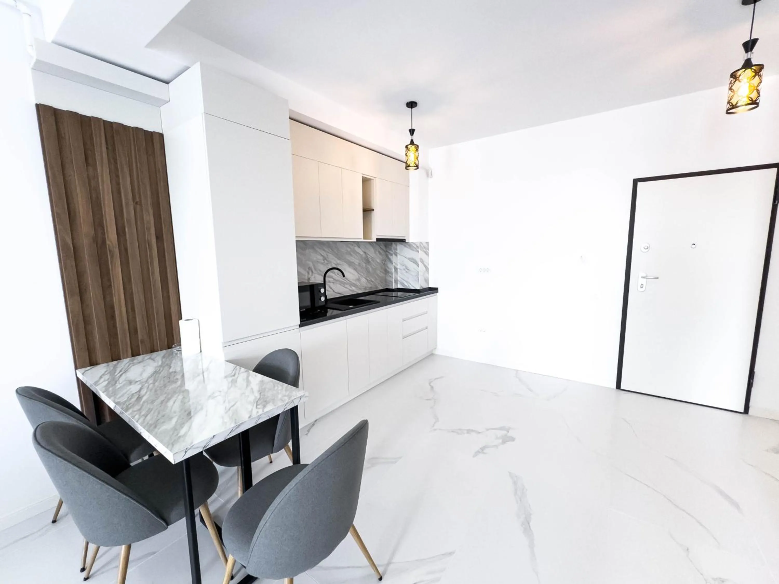 Kitchen or kitchenette in Wave 6 Apartments