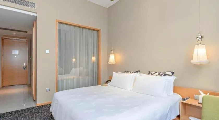 Bed in Guangzhou Carat Hotel