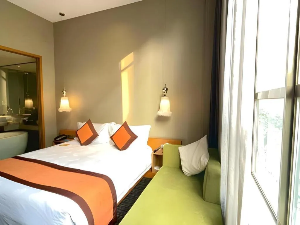 Bed in Guangzhou Carat Hotel