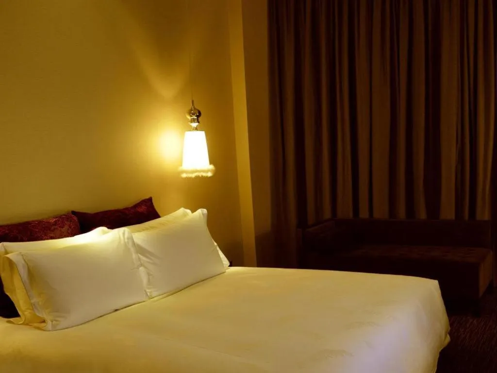 Bed in Guangzhou Carat Hotel