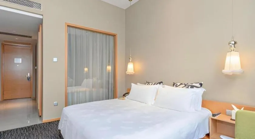 Bed in Guangzhou Carat Hotel