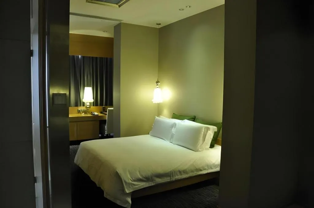 Bed in Guangzhou Carat Hotel