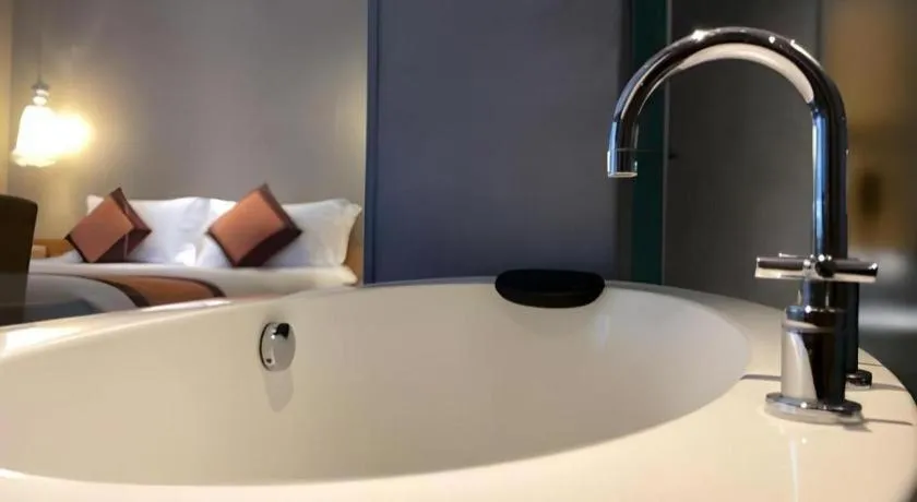 Bed in Guangzhou Carat Hotel