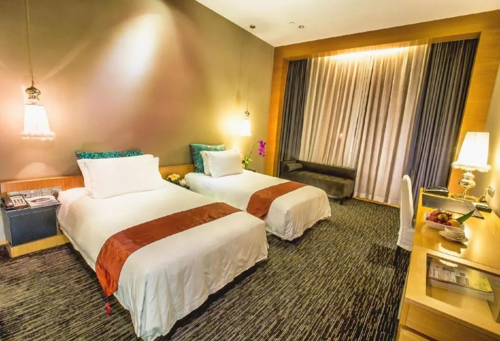 Bed in Guangzhou Carat Hotel