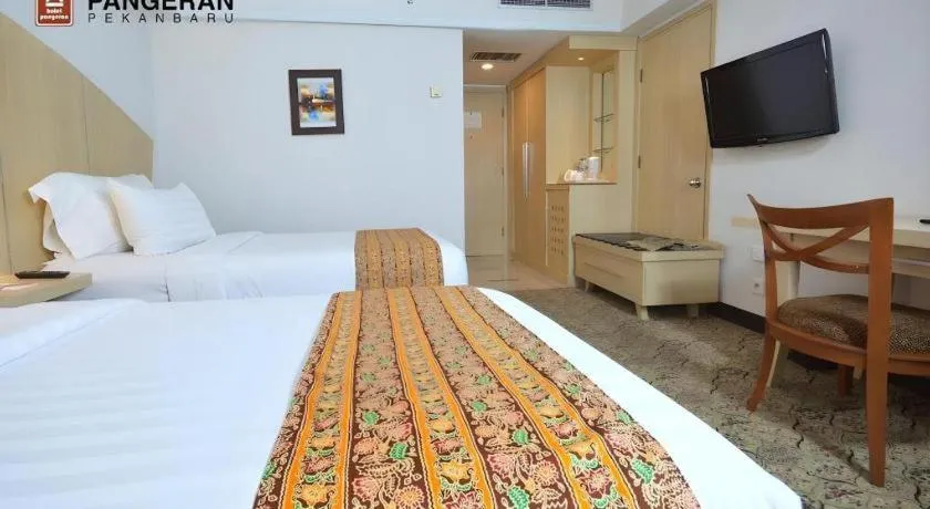 Bed in Hotel Pangeran
