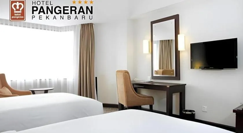 Bed in Hotel Pangeran