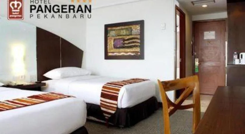 Bed in Hotel Pangeran