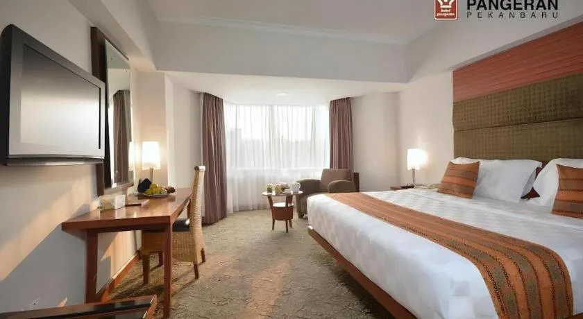 Bed in Hotel Pangeran