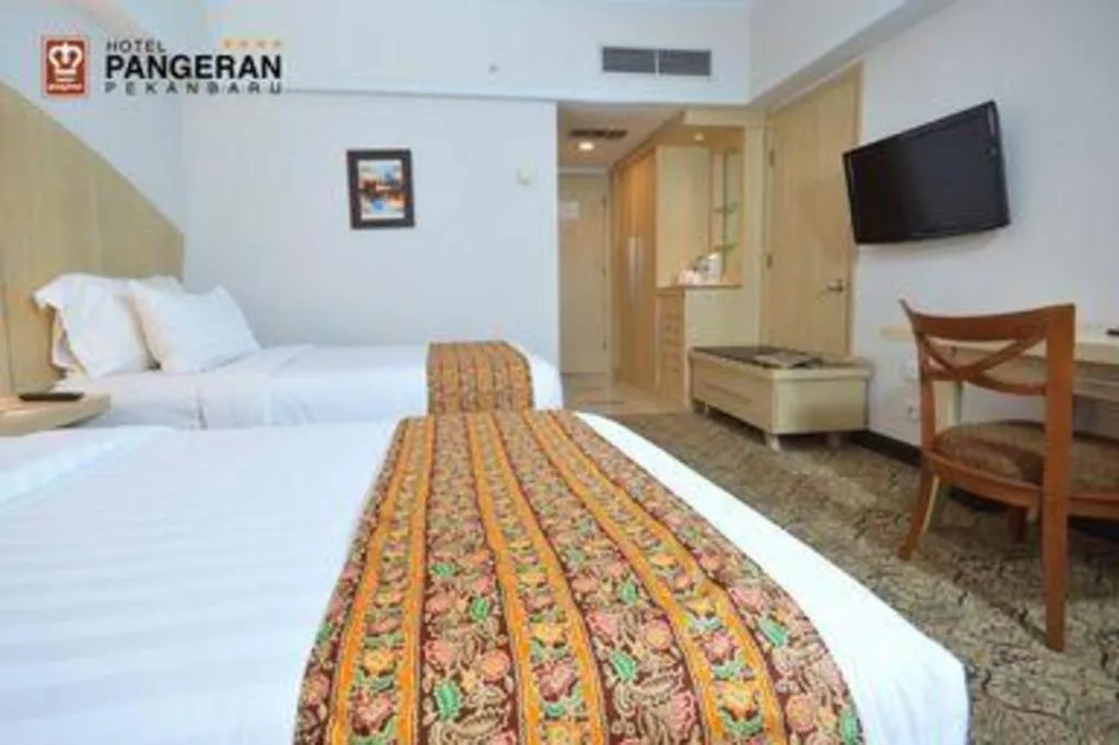 Bed in Hotel Pangeran